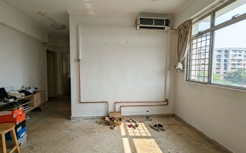 Empty rooms in a newly renovated Singapore flat with piping and trunking already run for aircon installation before furniture moves in